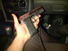 Police-issue hand-gun in the car on the way to the nightclub