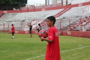 Little Brazilian kid in a Coca-Cola sponsored soccer jersey