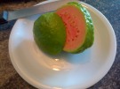 Guayaba fruit, sliced open to reveal its sweet pink flesh