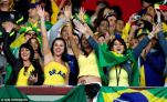 Hot Brazilian girls cheering Brazil on in the stadium World Cup 2014